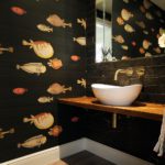 1. A beautiful cloakroom featuring Acquario wallpaper from Cole & Son.