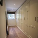 1. A row of our bespoke fitted wardrobes disguises the entrance way to this en-suite bathroom