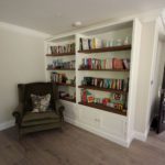 1. We made a simple open bookshelf unit with double door storage below. We love the warmth of the walnut shelving.