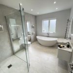 1. Light and bright. A large family bathroom tiled with Moon Onyx tiles from Minoli.