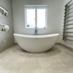 10. Breeze freestanding quarrycast stone bath with hansgrohe Talis floorstanding bath shower mixer.