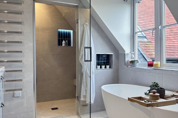 Large steam room shower and freestanding Victoria & Albert bath.